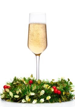 Champagne glass with christmas decoration on white background