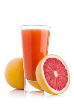 Glass of fresh grapefruit juice with fruit on white background