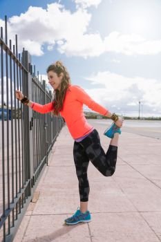 young woman stretching on the outdoors before to run