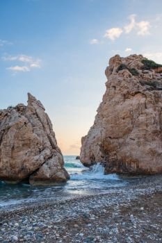 Afternoon view of breaking waves at the pebbly beach around Petra tou Romiou, in Paphos, Cyprus. It is considered to be Aphrodite’s birthplace in Greek mythology.