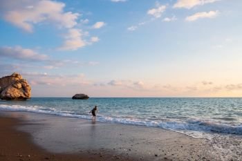 A barefooted boy plays at the beach at the Petra tou Romiou rocks, in Paphos, Cyprus. The beach is considered to be Aphrodite’s birthplace in Greek mythology.