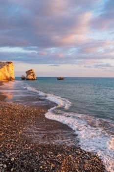 Beautiful afternoon view in  portrait format of the beach around Petra tou Romiou, in Paphos, Cyprus. It is considered to be Aphrodite’s birthplace in Greek mythology.