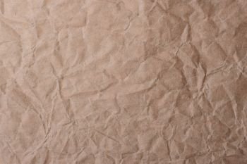 Brown crumpled creased paper bag for background or backdrop