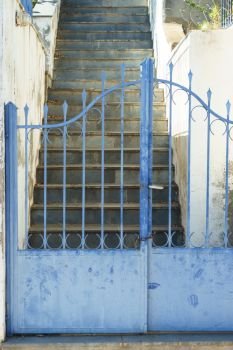 Typical Greek architecture details concept. Blue fence outdoor house during summer weather.. Blue fence outdoor