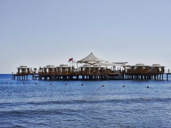 Beautiful restaurant on water. The beach of Antalya city. Mediterranean Sea, Turkey. May 2017