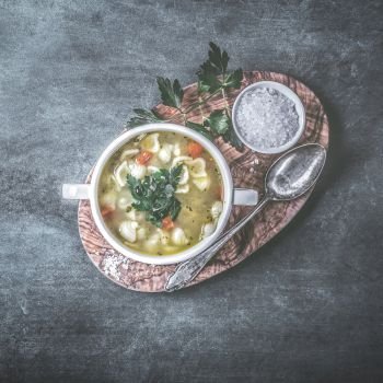 Chicken soup with noodles and parsley