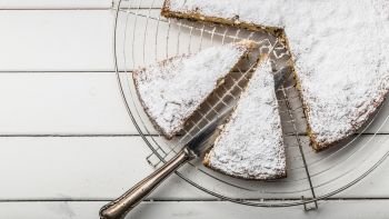 Homemade cake on a background with icing sugar