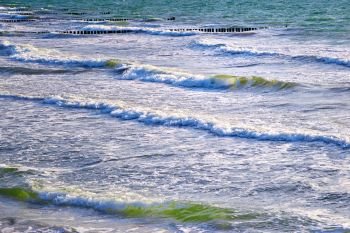 breaking waves rolling to beach
