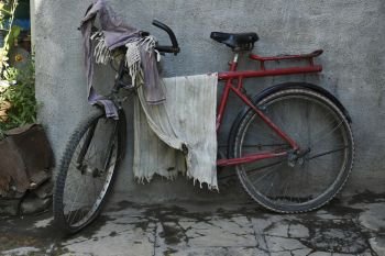 A bicycle used to dry the clothes in village Palashi, Parner, Ahmednagar.. A bicycle used to dry the clothes in village Palashi, Parner, Ahmednagar