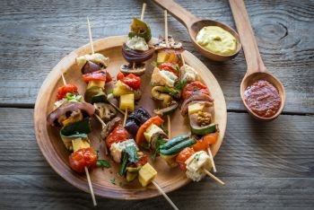 Grilled vegetable skewers on the plate