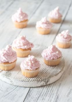 Many pink cream homemade cupcakes