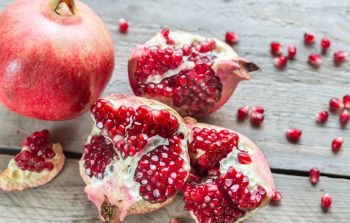 Pomegranate on the wooden background
