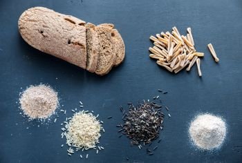 Wholegrain products on the dark wooden background