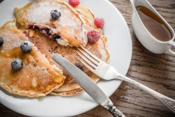 Pancakes with maple syrup and fresh blueberries