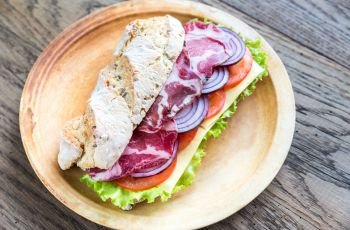 Sandwich with ham, cheese and fresh vegetables