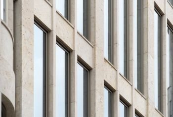 Detailed view of a building with high straight windows, strict geometry, architecture