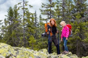 family - mother and daughter  hikers at the Carpathians mountains. gorgany, Ukraine.
