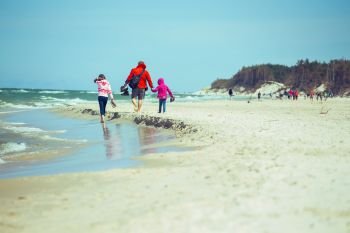 Family walking on the beach, Baltic Sea
