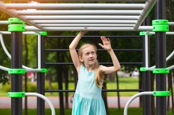 children on vacation - little girl on the playground at the park
