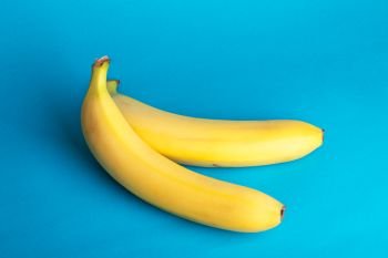 delicious ripe bananas on a blue background
