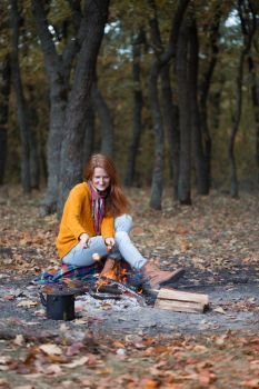 girl on picnic in the autumn forest
