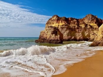 Beautiful beach with rocky cliffs in Portimao at the Algarve coast of Portugal