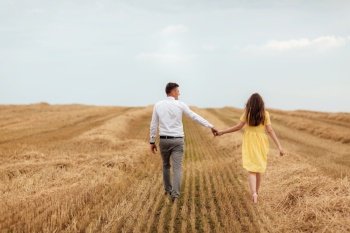 Happy young couple on straw, romantic people concept, beautiful landscape, summer season.. Happy young couple on straw, romantic people concept, beautiful landscape, summer season