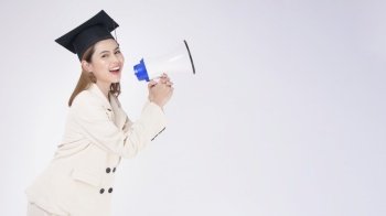 Portrait of young woman graduated over white background	