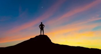 Silhouette of businessman on mountain top over sunset sky background, business, success, leadership and achievement concept