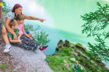 mother and son relax together in a mountain lake