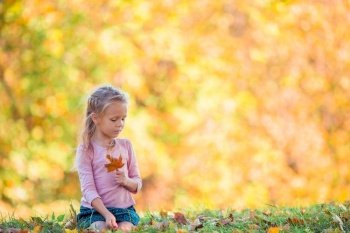 Portrait of adorable little girl outdoors at beautiful autumn day. Adorable little girl at beautiful autumn day outdoors