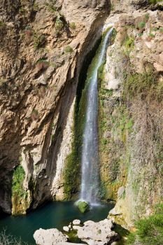 Waterfall in Ronda at the end of El Tajo river gorge, Andalusia, Spain.