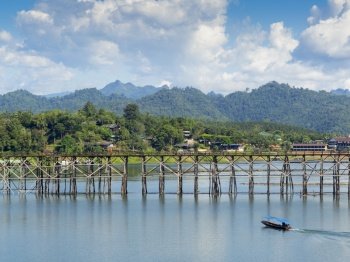 Beautiful view of an long old wooden bridge at Sangklaburi,Kanchanaburi province, Thailand
