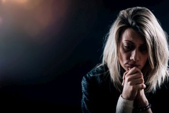 Depression disorder concept - close up image of melancholic female face. Depression Disorder – Portrait of a Melancholic Woman