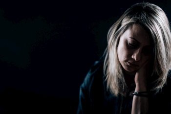 Dark portrait of depressed woman, depression disorder concept. Depression - Dark Portrait of a Depressed Woman 