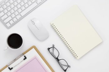 Minimal Office desk table top view with office supply and coffee cup on a white table with copy space, White color workplace composition, flat lay