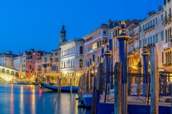 Cityscape image of Venice, in Italy during sunrise with Gondolas 