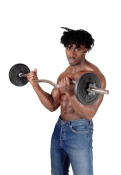 A young black man standing in jeans and topless, looking into the camera lifting some weights, isolated for white background