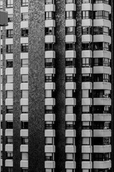 A close up of a repetitive building on black and white with copy space and cinematic ambient