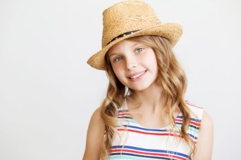 lovely little girl with straw hat against a white background