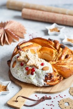 Sweet Bread Wreath decorated with stars cookies. Honey brioche garland with dried berries and nuts. Holiday recipes. Braided Bread. Cinnamon Twist Bread Wreath. Christmas Wreath Bread