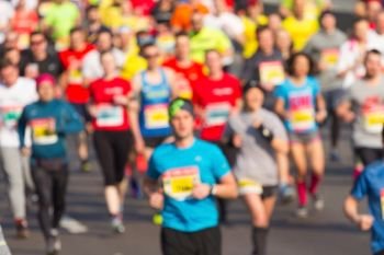 City marathon of blurred people runners