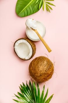 Coconut oil, tropical leaves and fresh coconuts, flat lay, healthy life concept