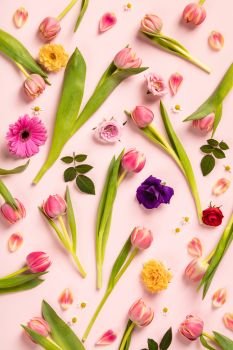 Floral pattern with pink tulips, flowers and leaves on pink background. Flat lay composition for entrepreneurs, bloggers, magazines, websites, social media and instagram.