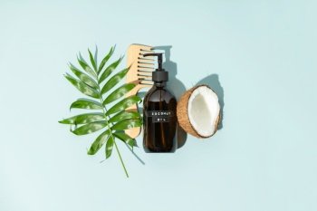 Natural cosmetics, coconut oil hair treatments concept, view from above, flat lay