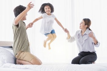 Asian cute family spending happy time on holidays and playing together at home