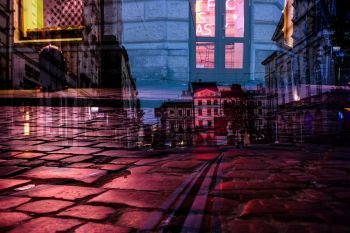 Illuminated old city night life abstract background. Double exposure image