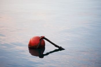 Red buoy in the sea. Ocean minimalistic landscape