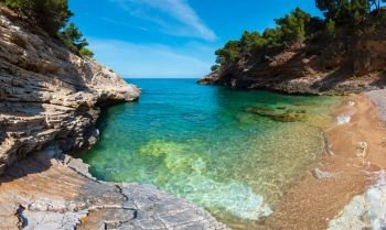 Summer Baia della Pergola small calm quiet beach, Gargano peninsula in Puglia, Italy.