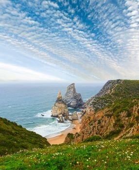 Atlantic ocean coast (granite boulders and sea cliffs) in cloudy weather. View from Cape Roca (Cabo da Roca), Portugal.